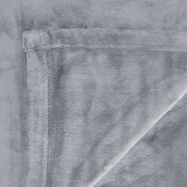 Close-up of soft grey plush rug corner