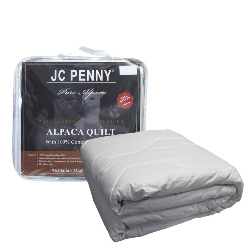 Folded alpaca quilt with JC Penney packaging