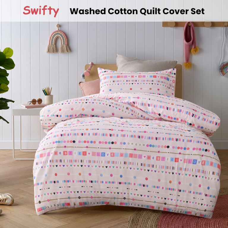 Pastel patterned cotton quilt cover on bed