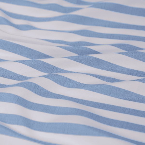 Blue and white striped fabric with soft folds