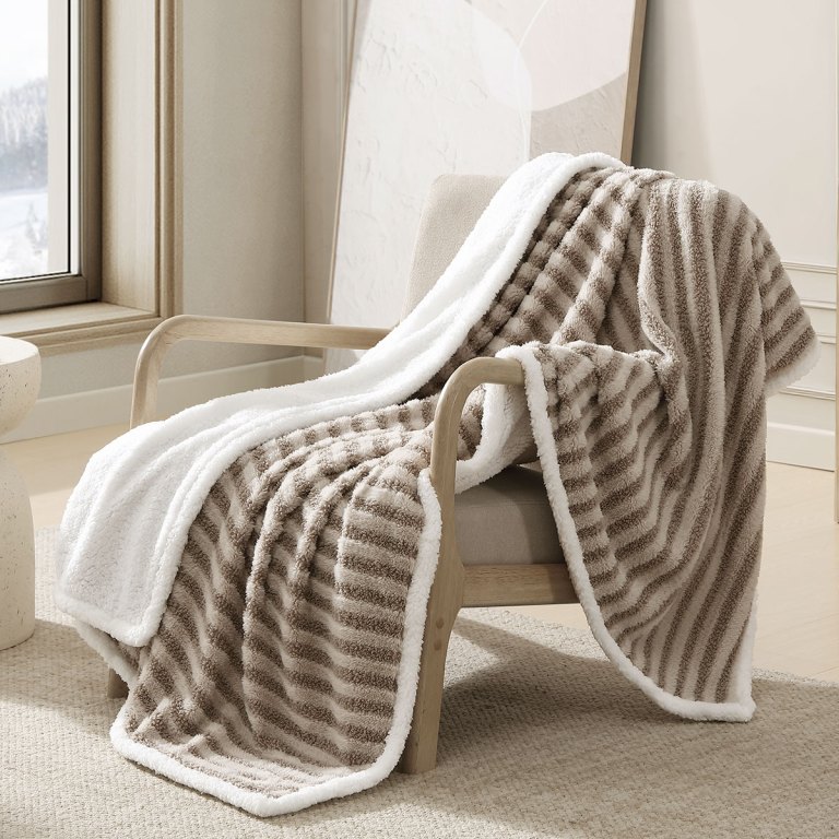 v442 int throw carterboucle multi re 202507031621 00.jpg Plush striped throw blanket draped over armchair