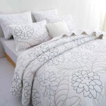 v442 stt coverlet eliana white qs 202601141150 00.jpg White floral quilt cover set on bed