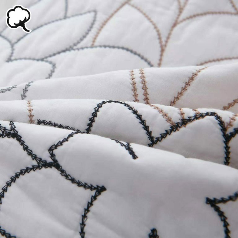 100% cotton coverlet set eliana queen Close-up of embroidered quilted white fabric