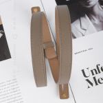 Beige leather handbag straps on magazine pages