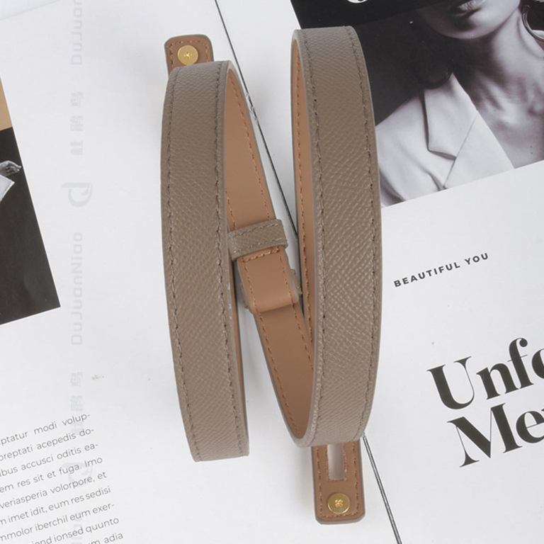 Beige leather handbag straps on magazine pages
