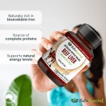 Hand holding Australian organic beef liver capsules bottle