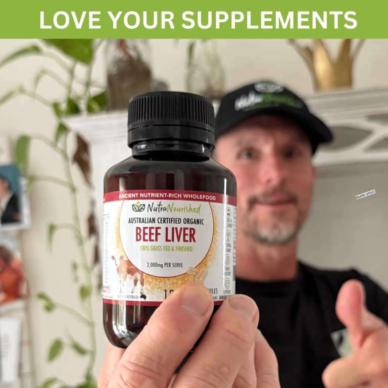 Organic beef liver supplement bottle held up