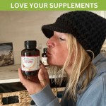 Woman holding organic beef liver supplement bottle