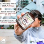 zeolite capsules Hand holding Australian zeolite supplement capsules bottle