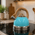 Turquoise kettle on modern kitchen stovetop