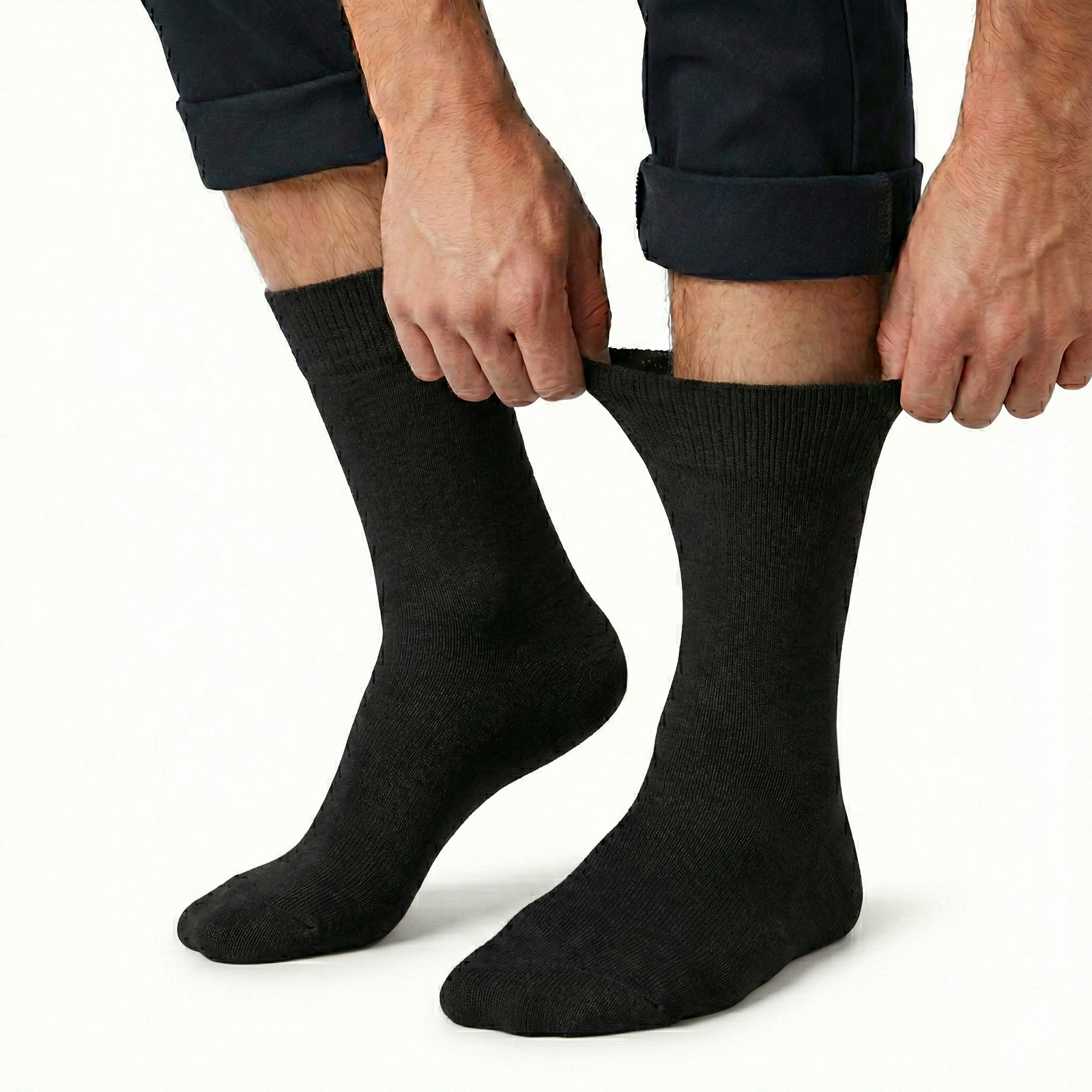 v563 cottonltsox blk11 14 202603161820 00.png Person pulling up black socks on white background