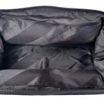 Open black toiletry bag with padded interior