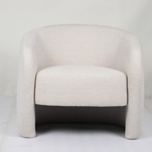 v637 e534021 202603021110 00.jpg Modern cream upholstered armchair against plain wall