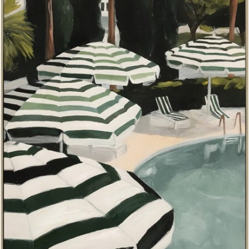 Striped umbrellas beside sunlit swimming pool