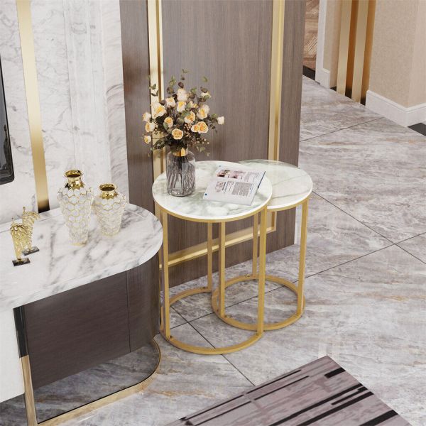 Marble and gold nesting side tables with flowers