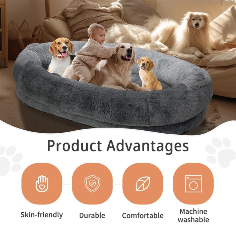 Baby with dogs on large grey pet bed
