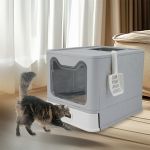 stainless steel enclosed cat litter box top exit pet toilet box w/ litter scoop Cat approaching covered litter box indoors