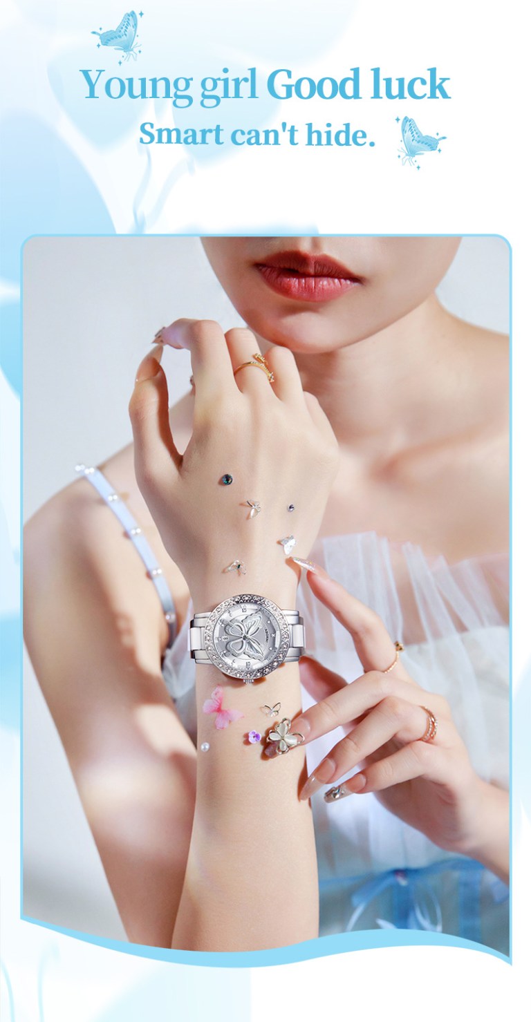 women's butterfly quartz watch with ceramic steel strap and luminous hands (silver shell white surface steel belt) Woman wearing silver butterfly watch close-up