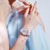 Woman wearing butterfly watch and blue dress