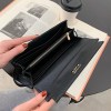 Black leather wallet opened over book and coffee