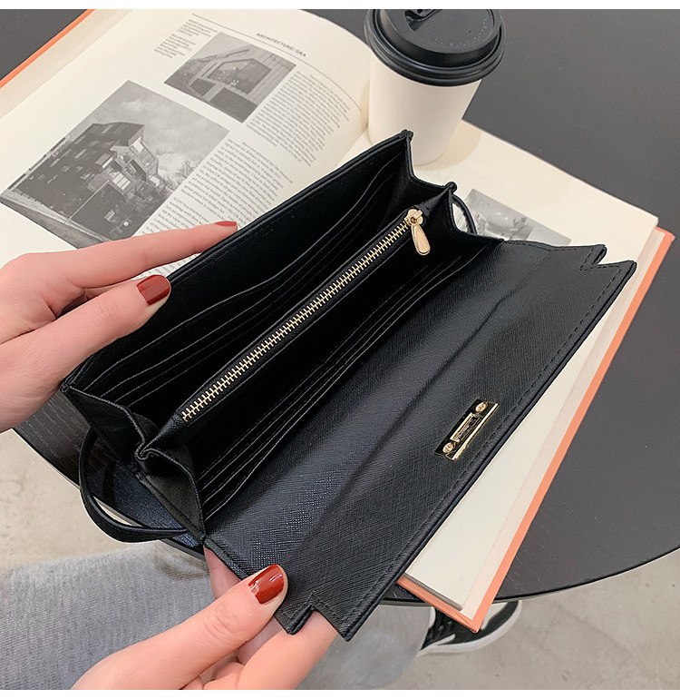 black elegant women's turn lock long wallet black pu leather clutch purse with card slots & zipper pocket Black leather wallet opened over book and coffee