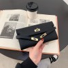 beige elegant women's turn lock long wallet black pu leather clutch purse with card slots & zipper pocket Black leather clutch over open book and coffee
