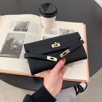 pink elegant women's turn lock long wallet black pu leather clutch purse with card slots & zipper pocket Black leather clutch over open book and coffee