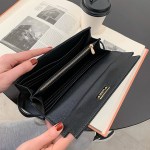 pink elegant women's turn lock long wallet black pu leather clutch purse with card slots & zipper pocket Black leather wallet held open over book
