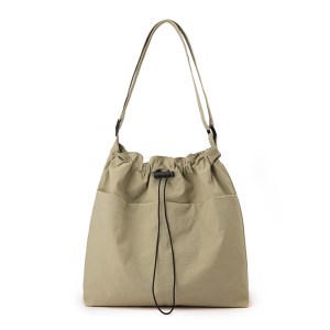 Beige drawstring shoulder bag with long strap