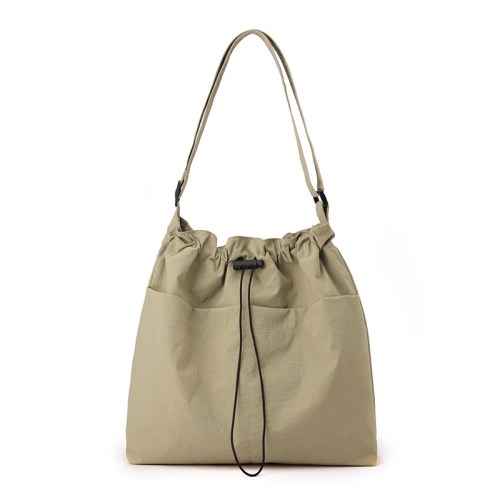 Beige drawstring shoulder bag with long strap