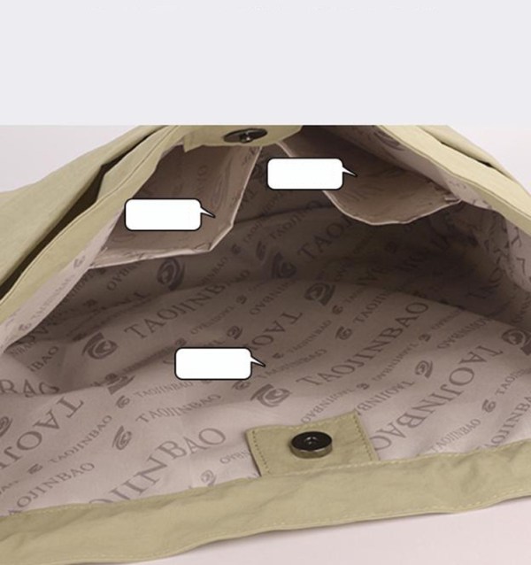 Inside view of handbag with branded lining