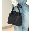 Black tote bag with light blue jeans outfit