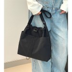khaki chic lightweight nylon drawstring tote bag multi pocket casual shoulder & crossbody Black tote bag with light blue jeans outfit
