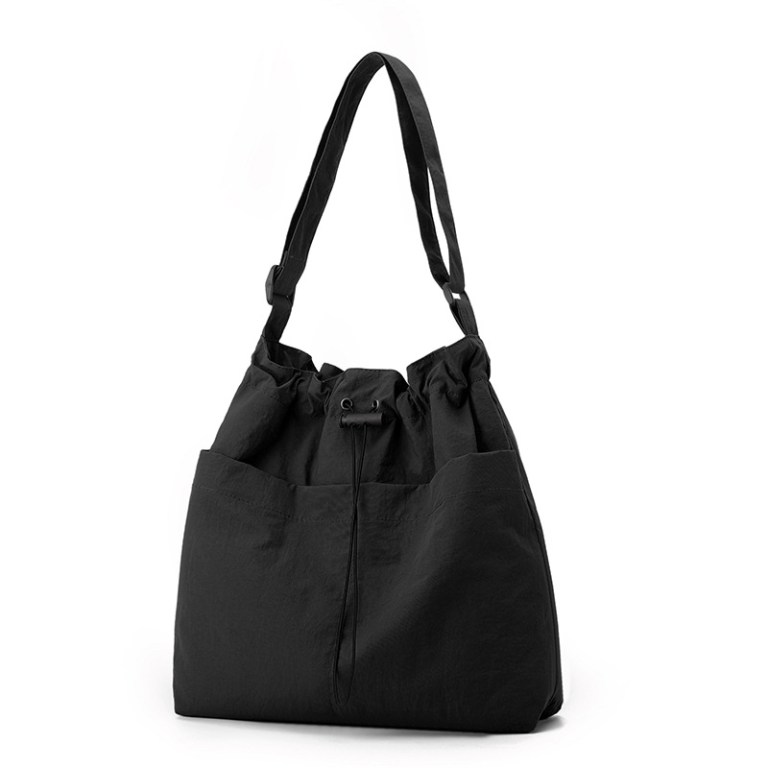 Black drawstring shoulder bag on white background