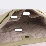 Inside view of lined handbag with snap closure