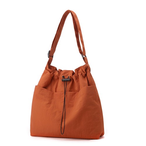 Burnt orange shoulder bag with drawstring closure