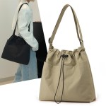 Beige drawstring shoulder bag with wide strap