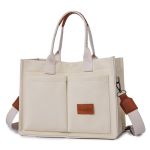 Cream canvas tote bag with leather accents