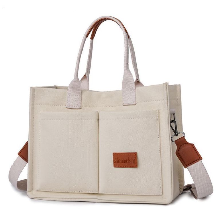 Cream canvas tote bag with leather accents