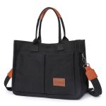 Black canvas tote bag with brown accents