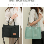 Black and mint canvas shoulder bags on models