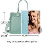 Mint green handbag beside A4 magazine for size