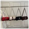 coffee color fashion retro crossbody bag french chic small shoulder bag women’s baguette underarm bag Four small shoulder bags hanging on clothing rack
