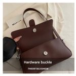 Brown leather handbag with hardware buckle detail