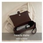 Brown leather crossbody bag showing interior capacity