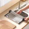 Roll-up stainless steel dish rack over sink