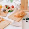 4 piece chopping block set with display Breakfast spread with bread roll, fruit and cupcakes