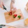 4 piece chopping block set with display Slicing fresh strawberries on wooden cutting board