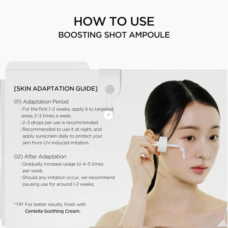 Woman applying facial serum with dropper