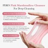 Pink marshmallow cleanser stretched between hands